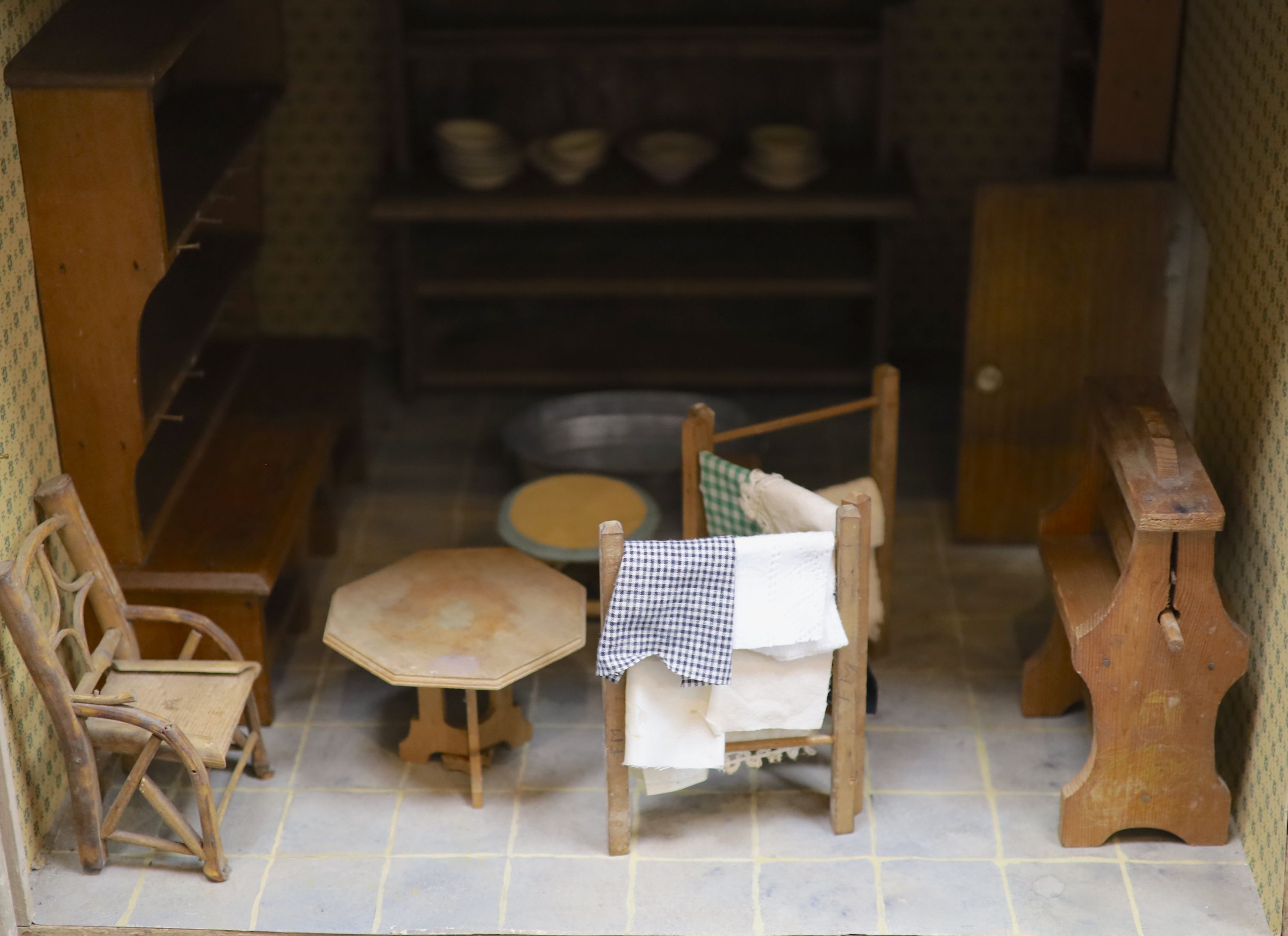 An unusually large painted pine doll's house, modelled upon a Victorian lodge house, Estate Carpenter made, Lake District width 198cm height 156cm